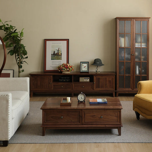 Living room with wooden furniture including a TV stand, coffee table, and cabinet.