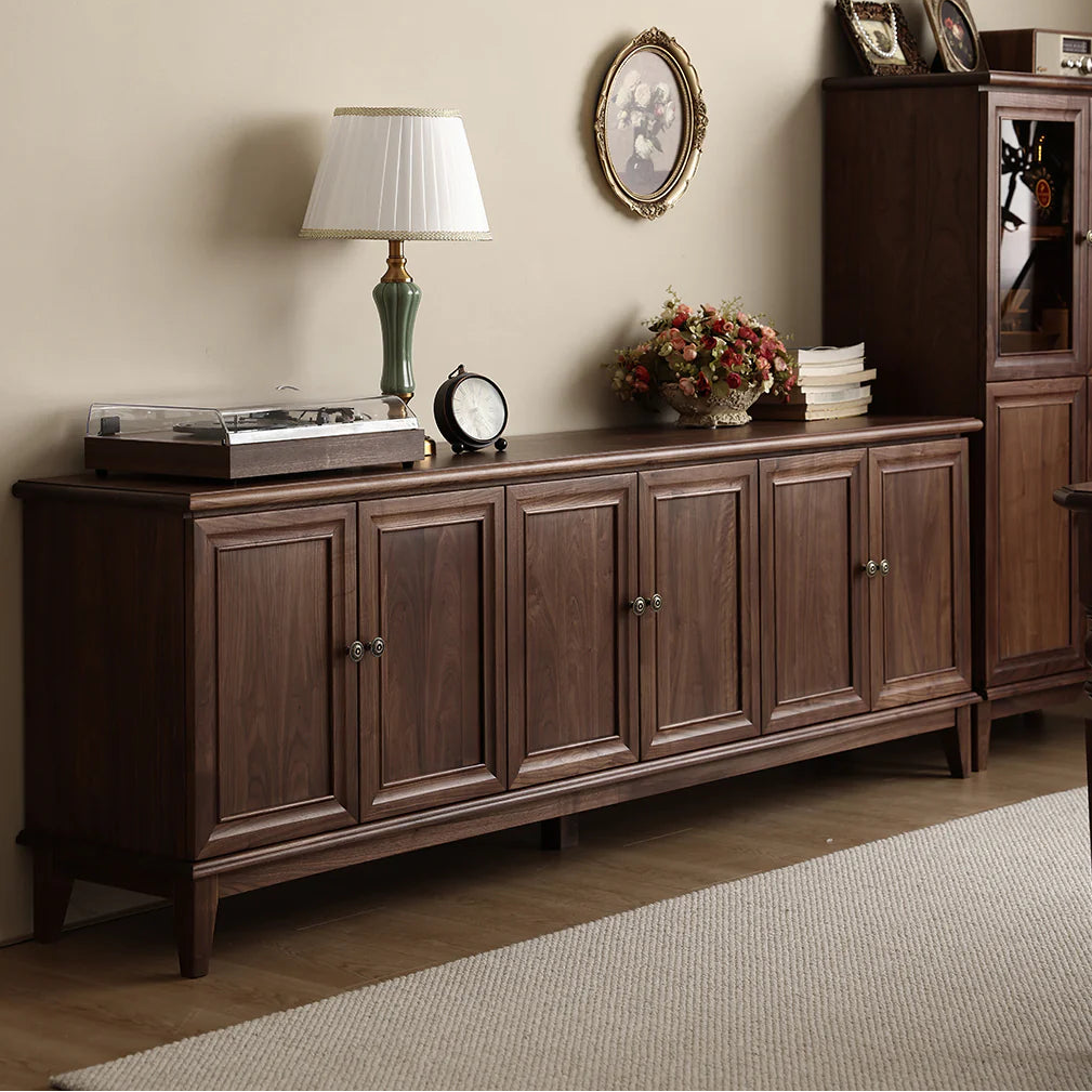 Wooden sideboard with decorative items in a room setting