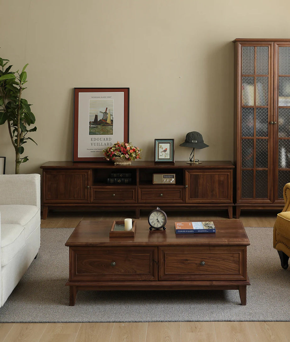 Living room with wooden furniture including a TV stand, coffee table, and cabinet.