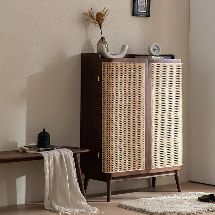 Wooden cabinet with wicker doors in a room setting